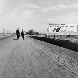 Rear View of Two Men Walking toward Los Angeles