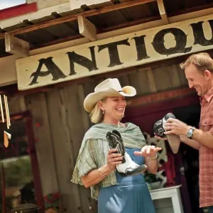 Smiling mature couple have fun shopping at the antique store together Smiling mature couple have fun shopping at the antique store together