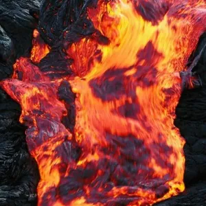 A Stream of Glowing Hot Pahoehoe Lava Moving Quickly Over a Ledge A Stream of Glowing Hot Pahoehoe Lava Moving Quickly Over a Ledge