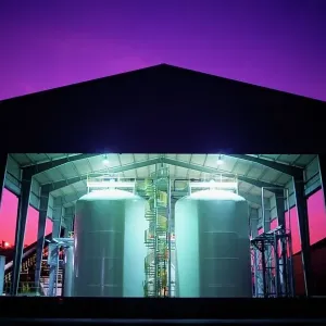 Toxic waste storage tanks at sunset, Texas, USA Toxic waste storage tanks at sunset, Texas, USA