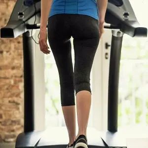 Woman exercising on treadmill
