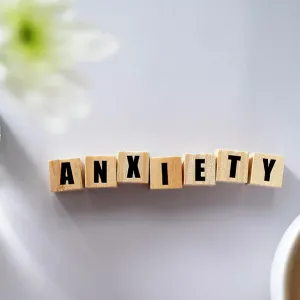 Wooden block with word ANXIETY. Mental health concept Wooden block with word ANXIETY. Mental health concept