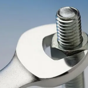 Wrench turning nut on bolt Wrench turning nut on bolt