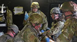 The 111th Medical Group provides aid to a simulated casualty during a readiness exercise on Friday