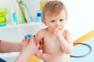 Physician Prints: 14 months old baby receiving vaccination