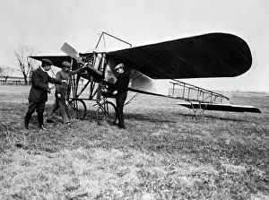 Manly Prints: 1910S Group Of Three Men Standing In Front Of Early Monoplane One With Hand On Propeller