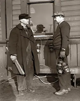Team Work Prints: 1920s 1930s TWO RAILROAD WORKERS HOLDING LANTERNS & FLAGS A FLAGMAN CONDUCTOR AND A BRAKEMAN MEETING AND TALKING