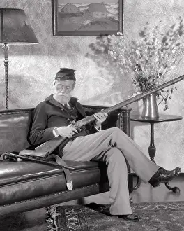 Dreams Prints: 1920s AMERICAN CIVIL WAR UNION ARMY VETERAN ELDERLY SENIOR MAN REMINISCING SITTING IN OLD UNIFORM HOLDING ANTIQUE RIFLE