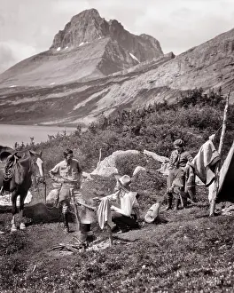 Physical Fitness Prints: 1920s THREE PEOPLE EASTERN VACATION COUPLE AND WESTERN COWBOY COOK AT CAMPSITE BY BAKER LAKE BANFF NATIONAL PARK