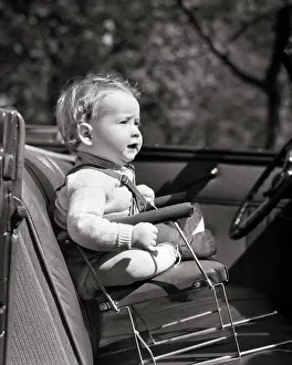 Innovation Prints: 1930s 1940s BABY SITTING ON PRIMITIVE DANGEROUS DESIGN WIRE CHILD CAR CHAIR NO SAFETY BELT IN FRONT SEAT OF CONVERTIBLE