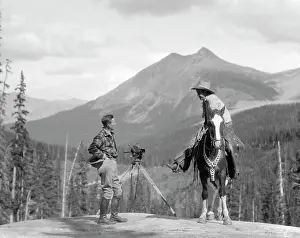 Hunt Prints: 1930S Cameraman In Boots Jodhpurs & Wool Hunting Shirt Standing Next To Movie Camera On Tripod Talking To Mounted