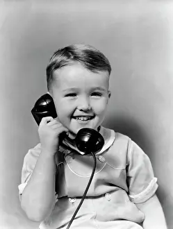 Speak Prints: 1930S Little Boy Smiling Talking On Telephone