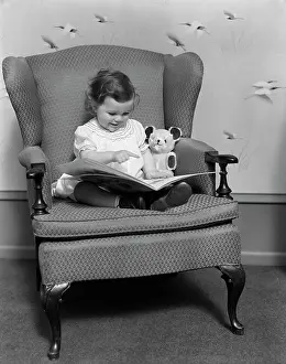 3 4 Years Prints: 1930S Little Girl Child In Large Chair With Bear Reading Book