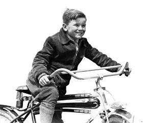 Expressions Prints: 1930s SMILING BOY IN AUTUMN CORDUROY JACKET KNEE SOCKS AND PANTS PEDALING HEAVY AMERICAN SPACE SHIP DESIGN STYLE