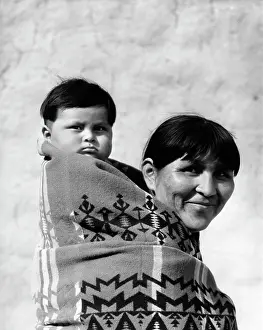 Parenting Prints: 1930S Smiling Pueblo Mother & Child On Back Both Wrapped In Woven Blanket Papoose
