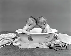 Relationships Prints: 1930S Two Twin Babies In Bath Tub Looking Down