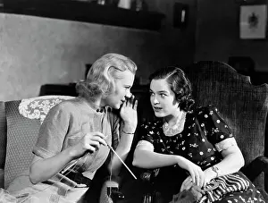 Oldtime Prints: 1930s TWO WOMEN SITTING IN CHAIRS IN PRIVATE CONVERSATION WOMAN HAS HAND TO SIDE OF MOUTH TO TELL SECRET