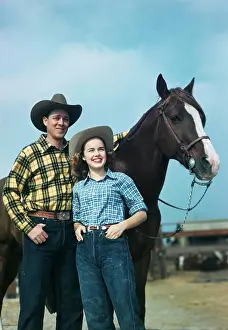 Husband Prints: 1940S 1950S Teen Couple In Western Wear Standing By Horse Smiling
