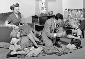 Oldtime Prints: 1940s FAMILY FATHER MOTHER DAUGHTER SON TOGETHER IN LIVING ROOM WITH TOY ERECTOR SET