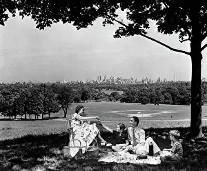 Sons Prints: 1940S Family Picnicking Under A Tree In Fairmont Park With Skyline Of Philadelphia Pa On Horizon