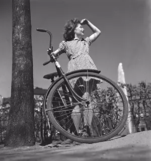 Bicycle Prints: 1940s girl with bicycle. A teenage girl