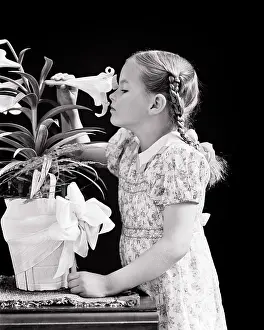Curiosity Prints: 1940s GIRL WITH BRAIDS SNIFFING SMELLING SCENT OF A POTTED EASTER LILY