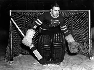 Gloves Prints: 1940S Serious Ice Hockey Goalie Standing In Front Of The Net With Gloves Padding Jersey And Puck