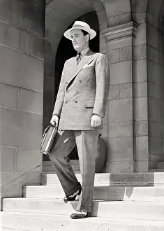 Weight Prints: 1940s MAN WALKING DOWN STEPS HOLDING BRIEFCASE WEARING GLEN PLAID DOUBLE BREASTED SUIT SPECTATOR WINGTIP SHOES SUMMER