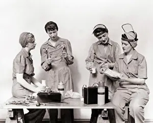 Lunch Prints: 1940s ROSIE THE RIVETERS FOUR WOMEN WW2 DEFENSE FACTORY WORKERS SHARING EATING LUNCH LOOKING OVER UNITED STATES SAVINGS