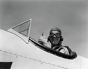 Planes Prints: 1940S Smiling Army Air Corps Pilot In Open Cockpit Wearing A Leather Flying Helmet Giving A Thumbs-Up Sign