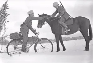 Soldiers Prints: 1940s soldier. A courier on his bicycle and a riding courier are exchanging a message