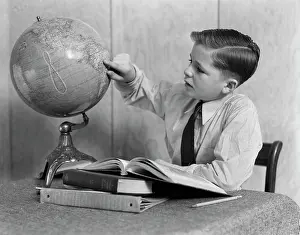 Globe Prints: 1940S Young Boy Studying With Books And World Globe