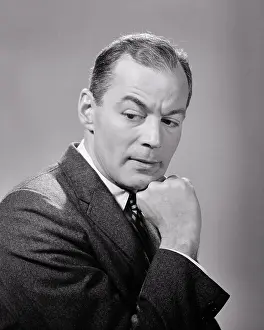 Moody Prints: 1950s 1960s BUSINESS MAN SERIOUS FACIAL EXPRESSION CHIN RESTING ON HAND THINKING CONCERNED WORRIED HAVING SECOND