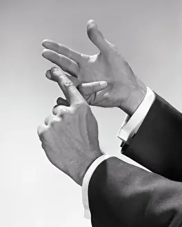 Talk Prints: 1950s 1960s MAN COUNTING ENUMERATING ITEMS ON HIS FINGERS ONE BY ONE