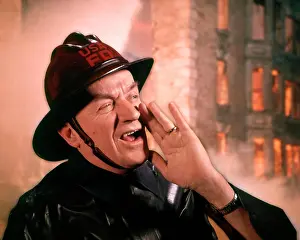 Oldtime Prints: 1950s 1960s MAN FIREMAN FIREFIGHTER YELLING WITH BURNING BUILDING IN BACKGROUND