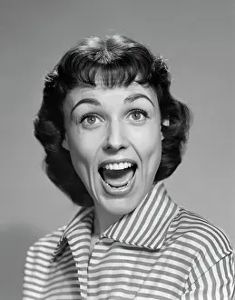 Grownup Prints: 1950s 1960s WOMAN BRUNETTE SMILING LAUGHING MOUTH OPEN WIDE HAPPY FUNNY FACE LOOKING AT CAMERA WEARING STRIPED BLOUSE