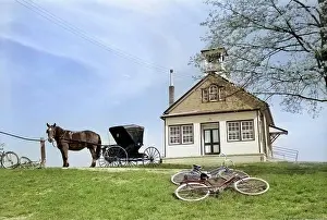Biking Prints: 1950s AMISH ONE-ROOM SCHOOLHOUSE AT TOP OF HILL HORSE & BUGGY & BICYCLES PARKED OUTSIDE LANCASTER PA USA