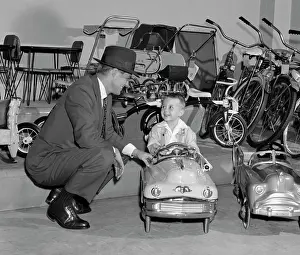 Sons Prints: 1950S Father In Toy Store With Son Driving Toy Convertible
