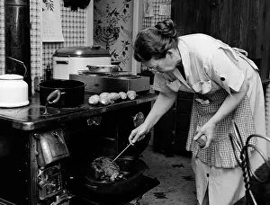 Prepare Prints: 1950S Housewife Testing Roast Beef In Oven To See If It Is Done Cooking