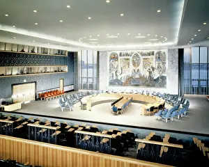 Worlds Prints: 1950s INTERIOR OF UNITED NATIONS SECURITY COUNCIL MEETING ROOM WITH MURAL OF PHOENIX RISING SYMBOL OF WORLDS RECOVERY