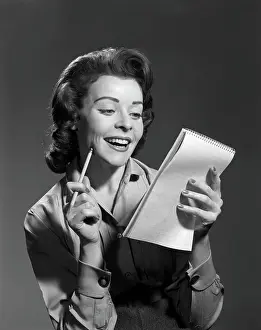 Pencil Prints: 1950S Smiling Young Woman Holding Pencil And Steno Notepad