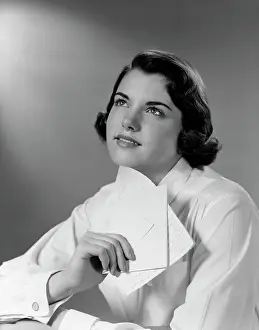 Dreams Prints: 1950S Teenage Girl Reading A Letter And Dreaming A Daydream