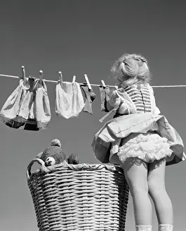 Braids Prints: 1950S Back View Of Girl Hanging Laundry