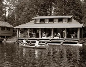 Boating Prints: 1950S Two Women Paddling In Canoe By Cabin In Lake Algonquin Park Canada Summer Camp Rustic Log Cabin