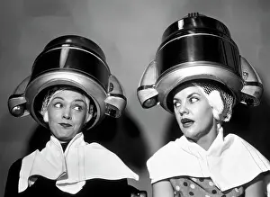Best Prints: 1950S Two Women Sitting Together Gossiping Under Hairdresser Hair Dryer