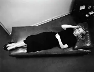 Ponder Prints: 1950S Worried Woman Hand To Forehead Seen From Above Lying Down On Psychiatrist Therapy Couch