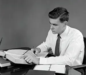 Reference Prints: 1950S Young Man Sitting At Desk Studying