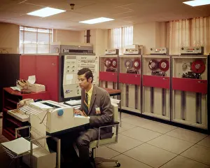 Expressions Prints: 1960s 1970s MANGETIC TAPE DRIVES MAIN FRAME COMPUTER ROOM MAN AT CONSOLE IBM SYSTEM DATA INFORMATION STORAGE
