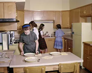 Students Prints: 1960S 4 Girls Students In Kitchen Home Economics Class Setting Table Cooking Education