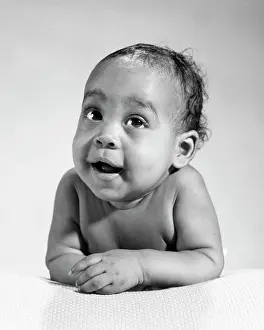 Expressions Prints: 1960s AFRICAN-AMERICAN BABY ARMS FOLDED IN FRONT LOOKING AT CAMERA DIRECTLY